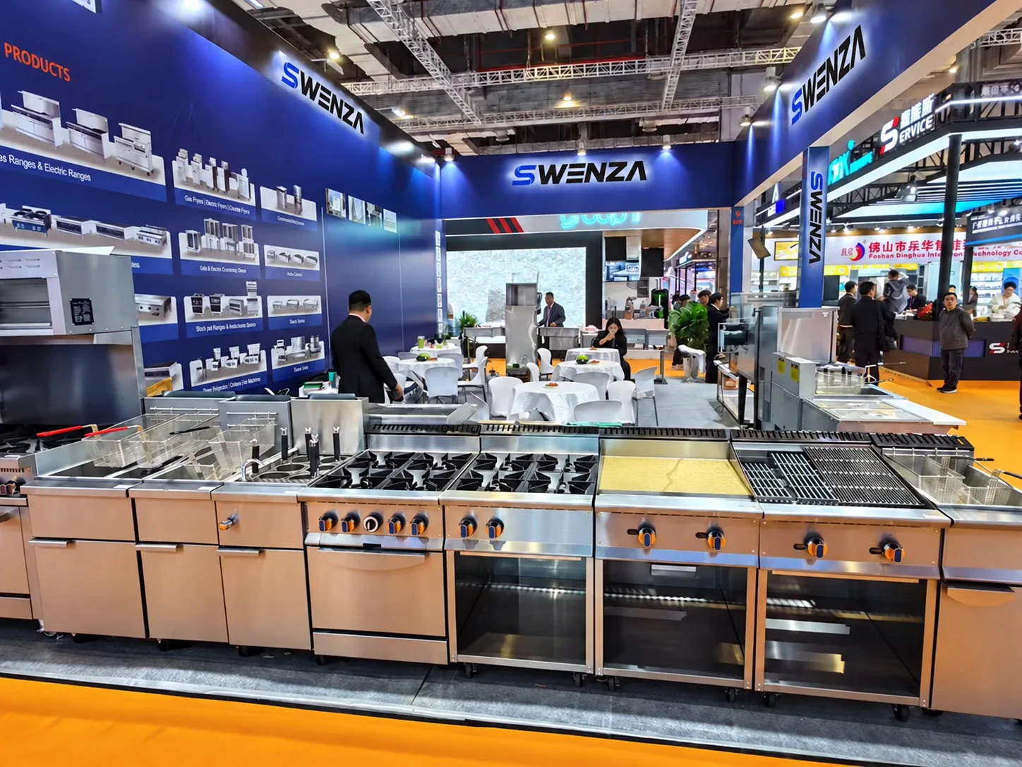 SWENZA cooking line on display: fryers, ranges, griddle and charbroiler